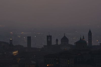 Illuminated buildings in city at night