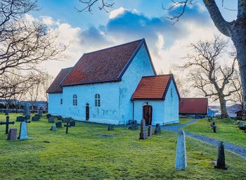 Church on field. a rural scene with a norwegian church near alesund, norway.