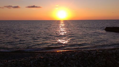 View of calm sea at sunset