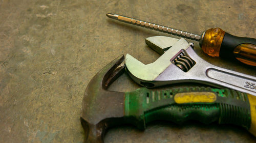 High angle view of metallic equipment on table