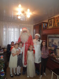 Rear view of people standing in traditional building