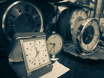 Close-up of clock on table