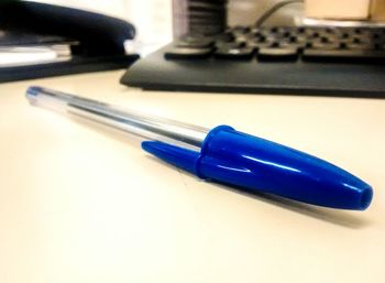 Close-up of pen on table