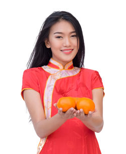 Portrait of a smiling young woman against white background