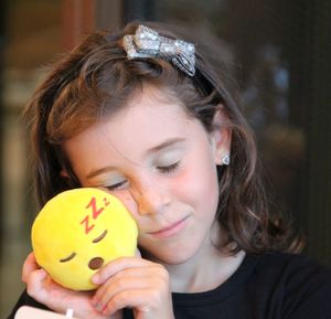 Close-up of girl holding toy