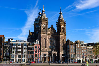 Buildings in city against sky