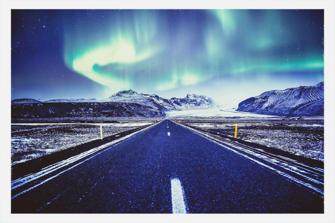 the way forward, night, illuminated, diminishing perspective, sky, road, cold temperature, winter, mountain, vanishing point, snow, transportation, transfer print, road marking, street light, auto post production filter, weather, mountain range, blue, empty road