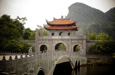 View of bridge over water against sky