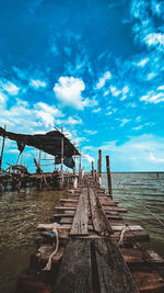 Pier over sea against sky