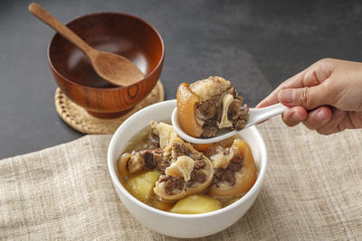 Midsection of person preparing food on table