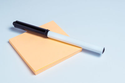 High angle view of pen on table against white background