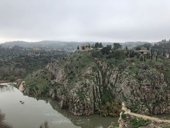 Panoramic view of trees and river against sky