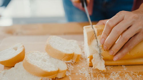 Cropped hand of person preparing food