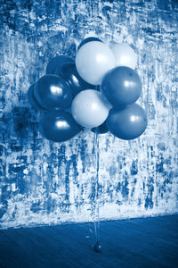 Close-up of balloons against water