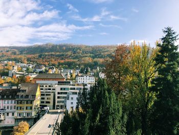 High angle view of trees and buildings against sky