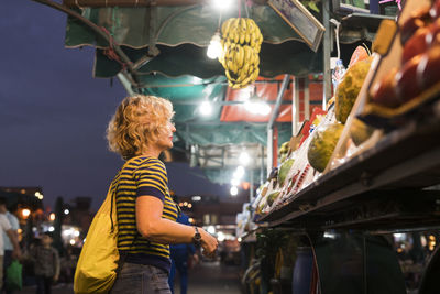 Morocco, woman at a market stall