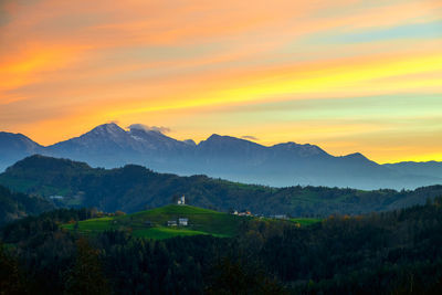 Scenic view of mountains against sky during sunset