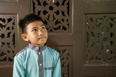 Portrait of cute boy at home