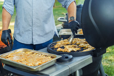 Midsection of man preparing food on table