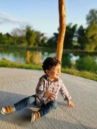 Boy sitting at park