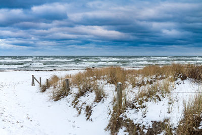 Scenic view of sea against sky during winter