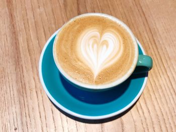 Close-up of cappuccino served on table