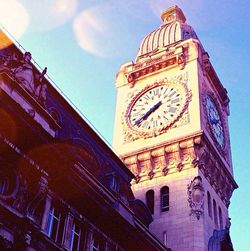 Low angle view of clock tower against clear sky