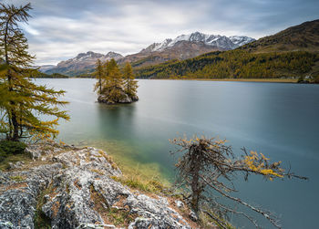 Scenic view of lake and mountains against sky