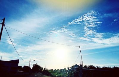 Low angle view of houses against cloudy sky