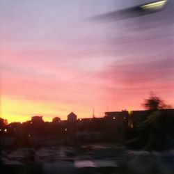 View of illuminated city at sunset