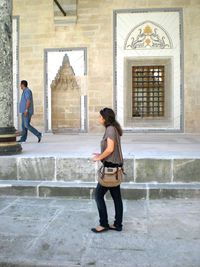 Man standing in front of building