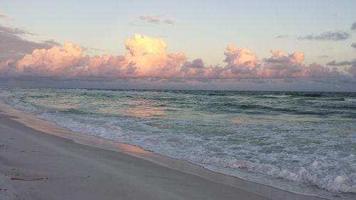 Scenic view of beach against sky during sunset