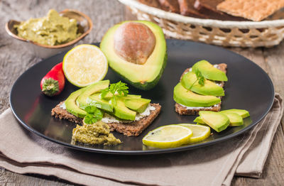 High angle view of fruits in plate on table