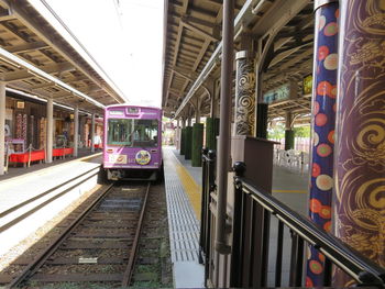 Train at illuminated railroad station