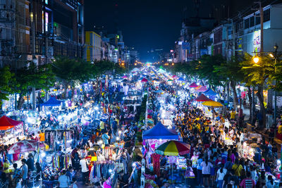 High angle view of people on street at night