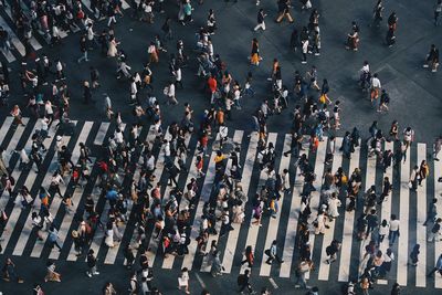 High angle view of people crossing road