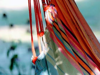 Close-up of multi colored hammock against blurred background