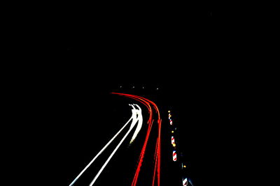 Light trails against sky at night