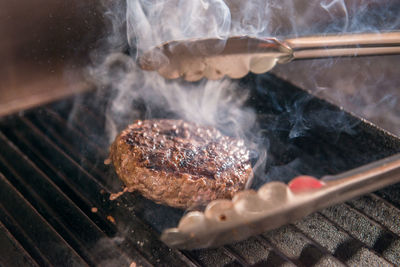 Close-up of meat on barbecue grill