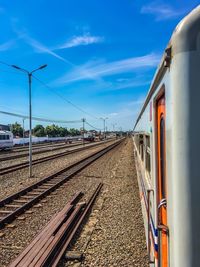 Train at railroad station against sky