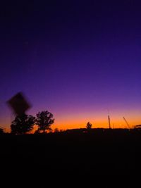 Scenic view of silhouette landscape against sky at night