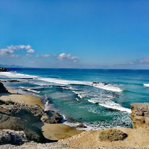 Scenic view of sea against blue sky