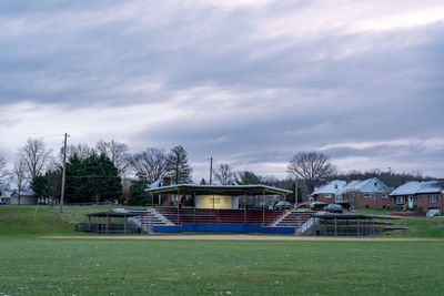 Built structure on field against sky