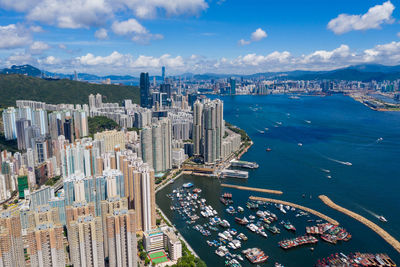 High angle view of buildings in city against sky