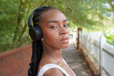 Portrait of young woman standing outdoors