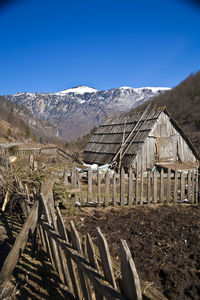 Scenic view of snowcapped mountains against clear sky
