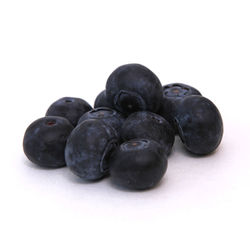 Close-up of black berries against white background