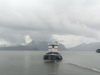 Boat in sea against sky