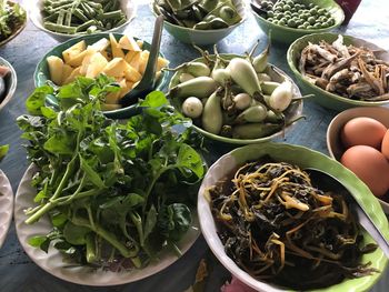 High angle view of various food in containers on table