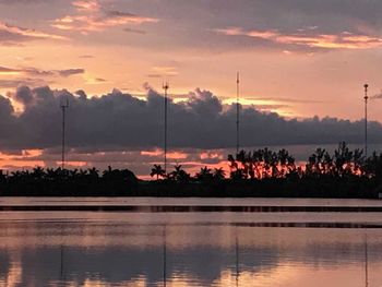 Scenic view of lake against orange sky